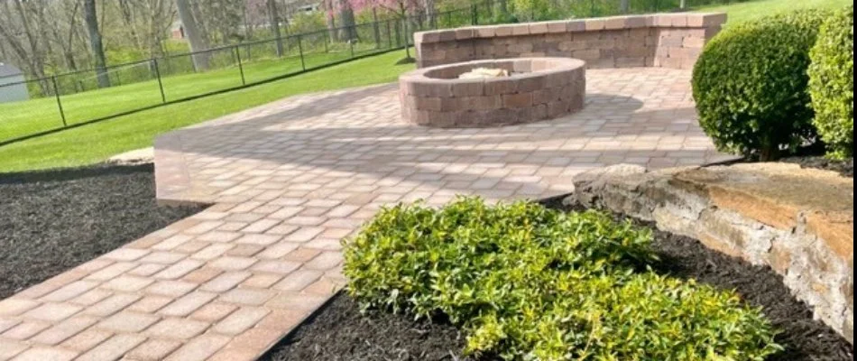 Paver patio in Landen, OH, with fire pit and seating wall.