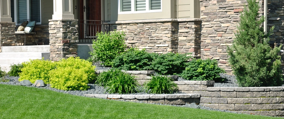 A custom built retaining wall in front of a home in Madeira, OH.