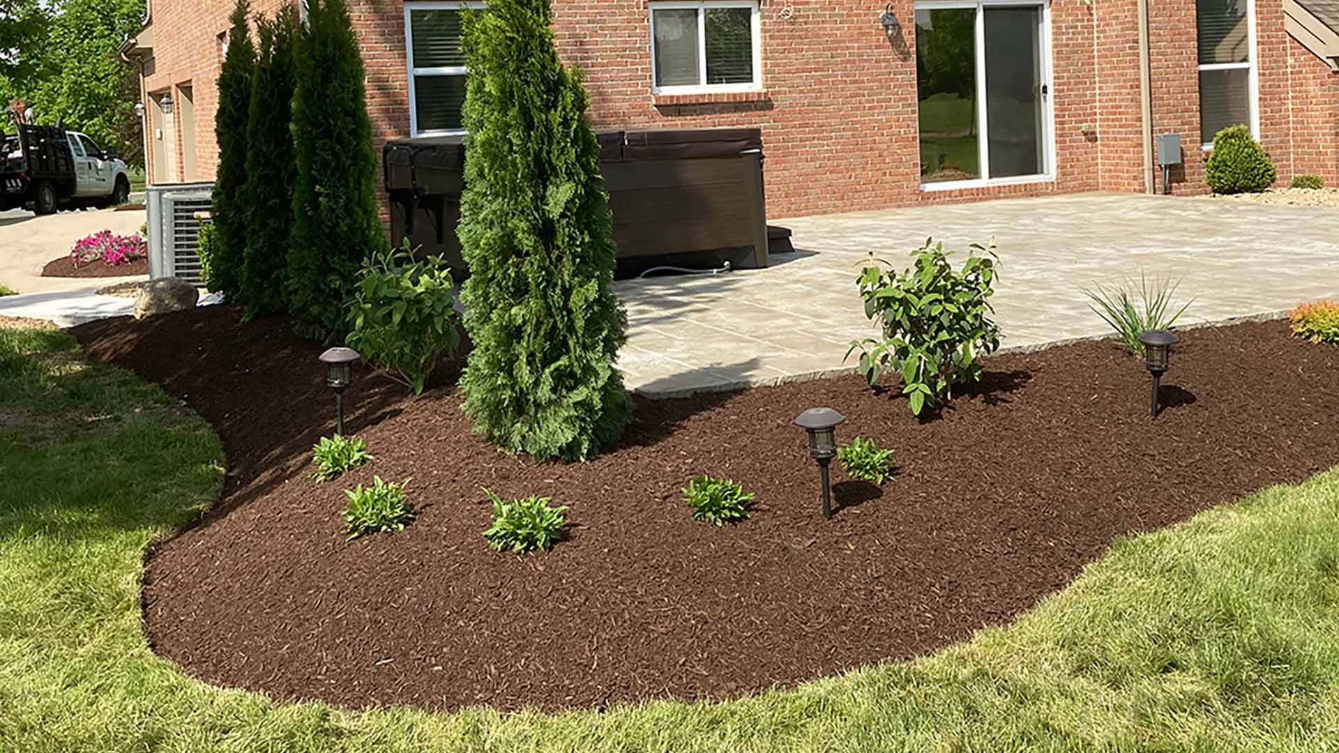 Mulch added to landscape bed in West Chester Township, OH.