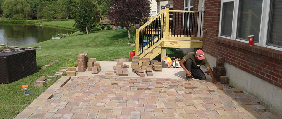 Pavers for patio installation being used by professional in Mason, OH.